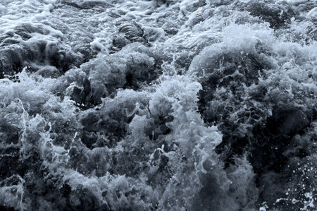 Surface of the water with waves and foam