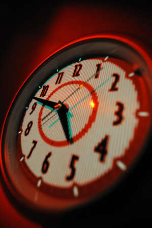 Alarm clock Alarm clock in red with analogue figuresの写真素材