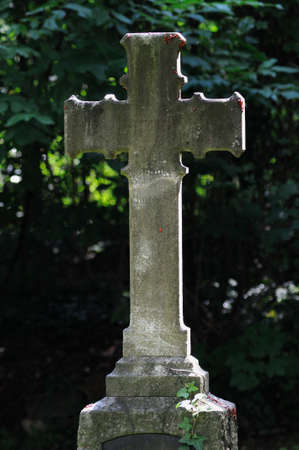 Stone cross Old cross of stone at a graveyard の写真素材