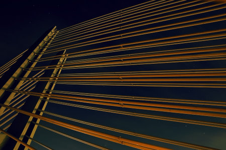 Bridge suspension Part of a modern suspension bridge at night