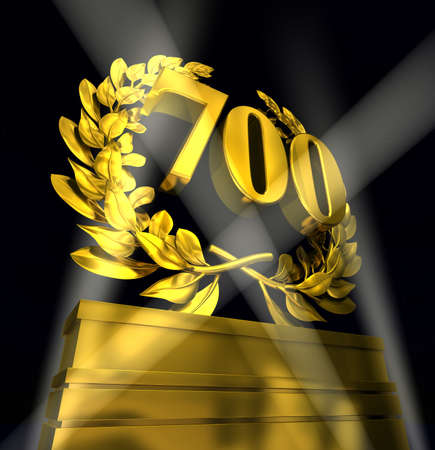 700 Seven Hundred number in golden letters at a pedestrial with laurel wreathの写真素材
