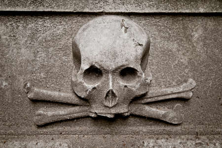 Gravestone with skullの写真素材