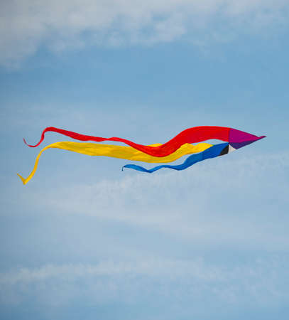 Abstract colorfull kite in a blue skyの写真素材