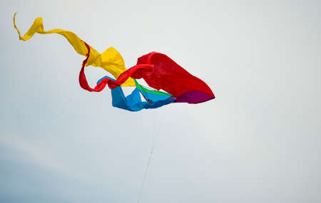 Abstract colorfull kite in a blue skyの写真素材
