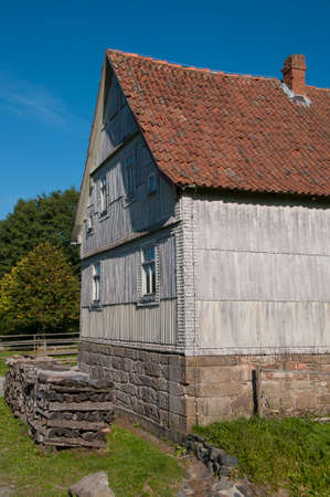 house with wooden boards decorated facade in a landscape Museumの写真素材