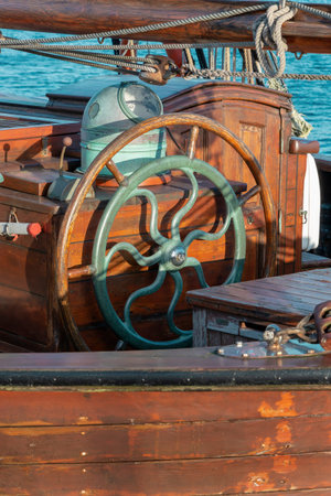 Single wooden wheel at an ancient sailing boat