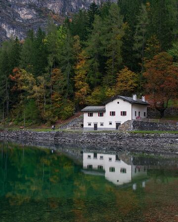 The lake house. Poschiavo lake - Switzerlandの写真素材