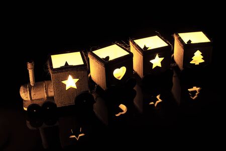 Train of lights. Old wooden toy.の写真素材