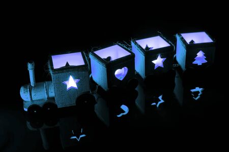 Train of blue lights. Old wooden toyの写真素材