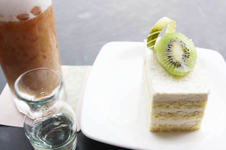 ice coffee with coconut cake and Kiwifruit の写真素材