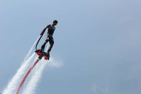 the ship flyboard acrobatics, November 24 2012 at the boat show  Ocean Marina in Pattaya, Thailand のeditorial素材