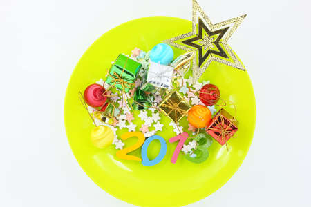 Colorful character Happy New Year greetings in plastic dishes の写真素材
