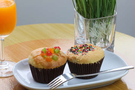Thai cup cake with fork and Orange juiceの写真素材