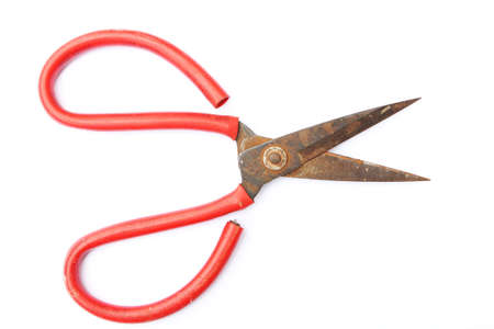 Old rusty sewing scissors isolated on white  の写真素材