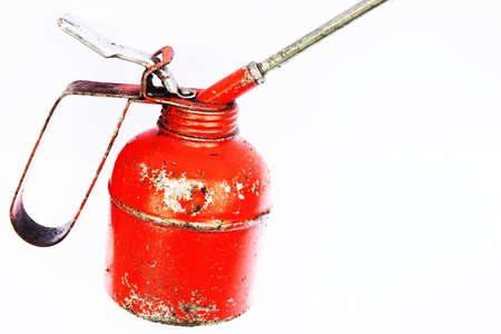 A red engine oil container isolated on white background の写真素材