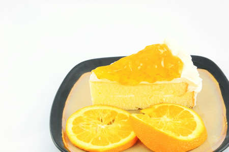 Orange jam cake on white background の写真素材