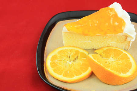 Orange jam cake on white background の写真素材