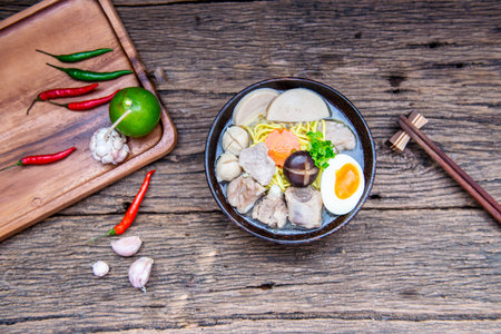 Chinese homemade pork soup noodle with egg, mushroom, pork balls, chilli, garlic , very yummy, soft...