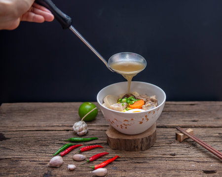 Chinese homemade pork soup noodle with egg, mushroom, pork balls, chilli, garlic , very yummy, soft...