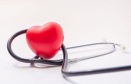 Red heart with coins and stethoscope, cost of checkup healthy concept ,COVID-19の写真素材