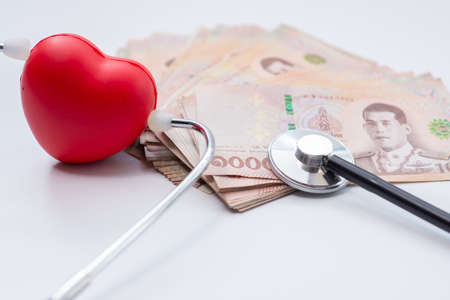 Stethoscope and Thai money bill, COVID-19, economy crisis conceptの写真素材