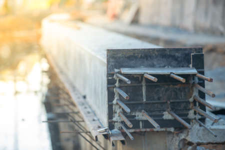 construction of a bridge over the river in autumn, close-upの写真素材