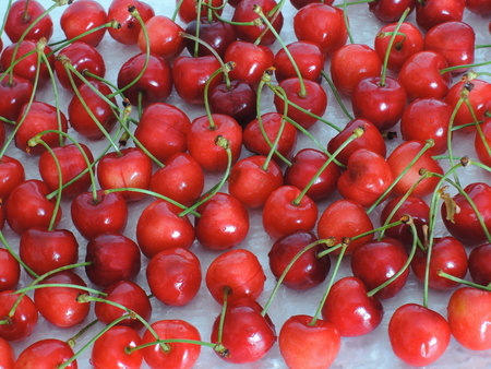 Ripe cherries on a light background
