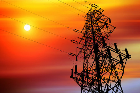High-voltage tower silhouette dusk