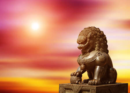 Chinese Imperial Lion Statue at sunsetの写真素材