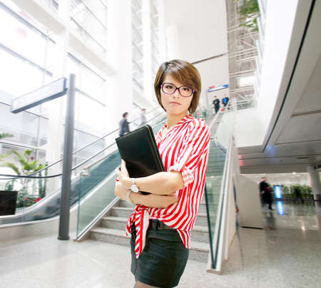 Young business woman on the background of a modern airportのeditorial素材