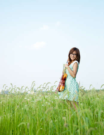 Young girl holding her violin の写真素材