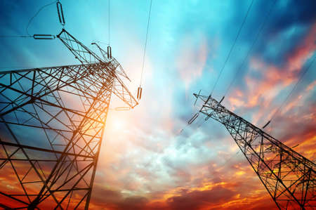 high voltage post at sunsetの写真素材