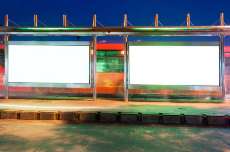 Blank billboard on bus stop at night の写真素材