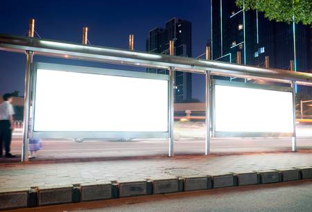 Blank billboard on bus stop at night の写真素材