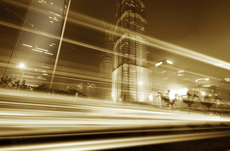 the light trails on the modern building background in shanghai china. 
