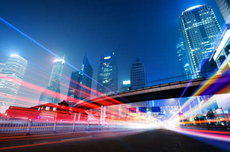 the light trails on the modern building background in shanghai china. の写真素材