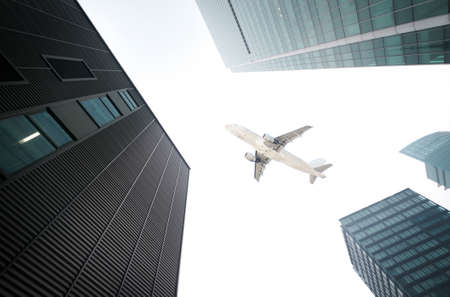 the airplane with the city scene background の写真素材