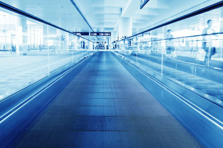 passenger rushing through an escalator in airport terminalのeditorial素材