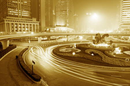 the light trails on the modern building background in shanghai china  