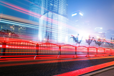 the light trails on the modern building background in shanghai china  
