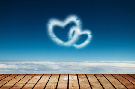 Two heart shaped clouds in the blue sky