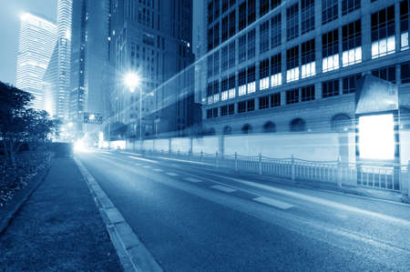 the light trails on the modern building background in shanghai china. のeditorial素材