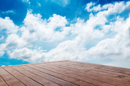 blue sky and wood floor backgroundの写真素材