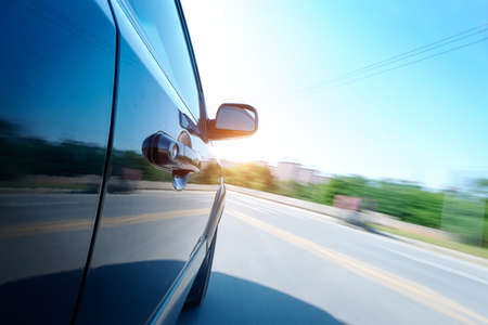 car on the road with motion blur backgroundの写真素材