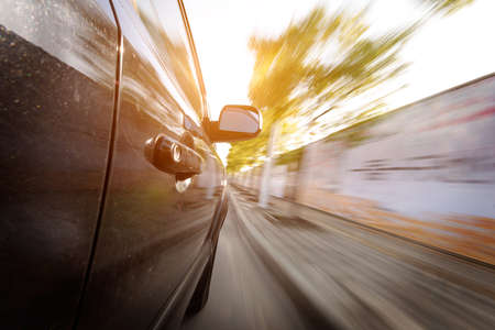 car on the road with motion blur backgroundの写真素材