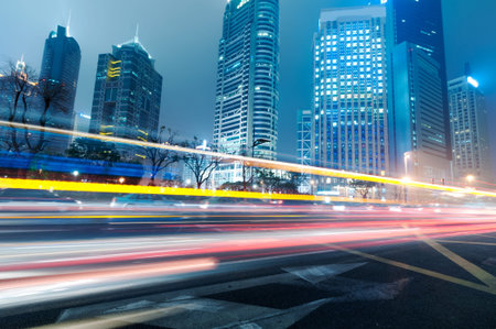 the light trails on the modern building background in shanghai china  