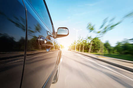 car on the road with motion blur backgroundの写真素材