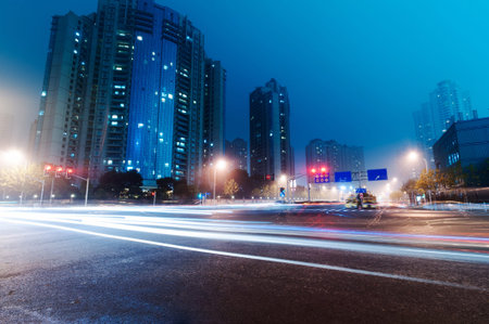 moving car with blur light through city at night