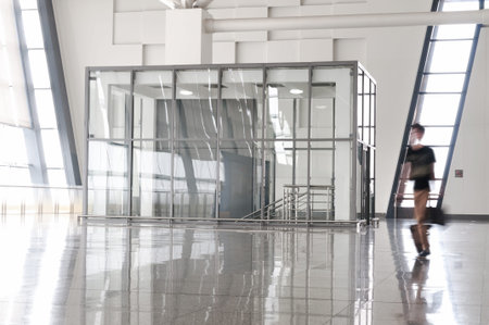 people silhouette in hall of office building 