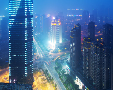 Bird view at Nanchang China  Skyscraper under construction in foreground  Fog, overcast sky and...